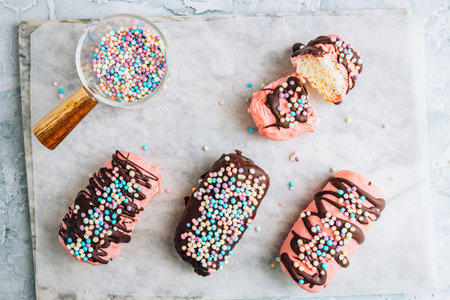 Homemade coconut chocolate bars coated in pink and dark chocolateの写真素材
