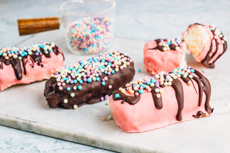 Homemade coconut chocolate bars coated in pink and dark chocolateの写真素材