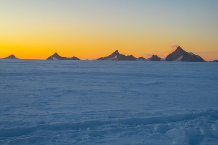 Beautiful sunset with ice hummocks and icebergsの写真素材
