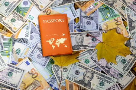 passport on the background of dollars and maple leaves. travel conceptの写真素材