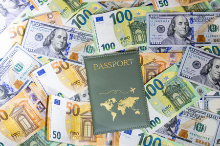 passport on the background of the dollar and euro banknotes.の写真素材