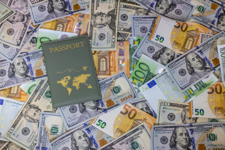 passport on the background of the dollar and euro banknotes.の写真素材