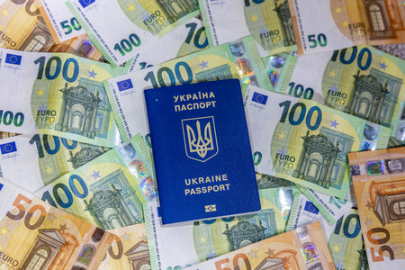 Ukrainian passport on a background of euro bills close-upの写真素材