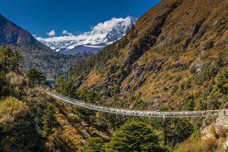 Bridge on Everest Base camp trek hike after the snowfall in October. Himalaya mountains, Nepal. Everest Base Camp trek beautiful landscapeの写真素材