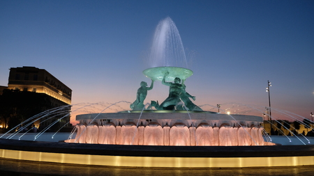 Valleta, capital city of Malta. View of the Triton Fountain, at the entrance of the city. Was designed and constructed between 1952 and 1959 and itÂ´s one of MaltaÂ´s most iconic Modernist landmarks.の写真素材