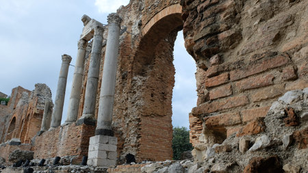 Teatro Antico di Taormina. Taormina, Province of Messina, Sicily. Looking the Ionian sea, this amazing greek theatre was built in the third century BC.の写真素材