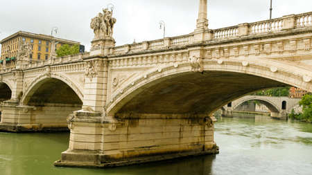 Rome, Tiber river. View of Ponte Vittorio Emanuele II, from below. The bridge was designed by architect Ennio De Rossi, and finished in 1911.の写真素材