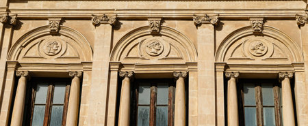 Ortigia, Syracuse. Sicily. Seminario Vecchio facade partial view, with several profiles in low...