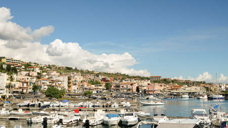 Early morning at the pier of Aci Trezza, a town of Sicily, located on the coast of the Ionian sea.の写真素材