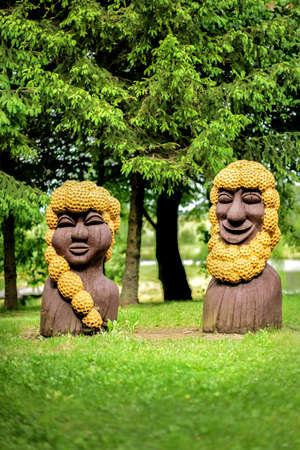 Lithuania, Vilnius - JUNE 20, 2017. National wooden statues in the garden on the lake shoreのeditorial素材