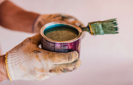 Open bucket of blue green paint isolatedの写真素材