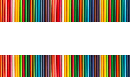 Colored pencils are arranged in a row on a white background on both sides of the canvas. Gradient color. Concept: banner on the topic of educational supplies. Isolateの写真素材