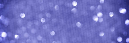 Blurred background. Modern abstract very peri round shining bokeh on a purple backdrop. Bannerの写真素材