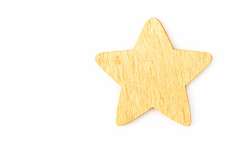 Christmas Tree wooden toy in the shape of a star. Isolate