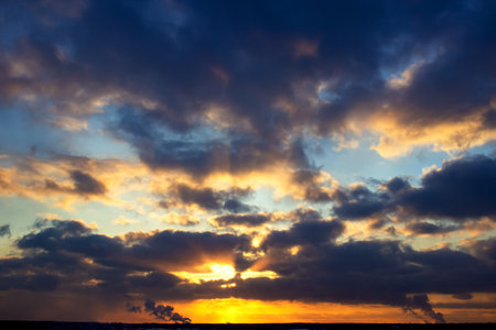 Blue orange sunset sky. Nature multicolored background.の写真素材
