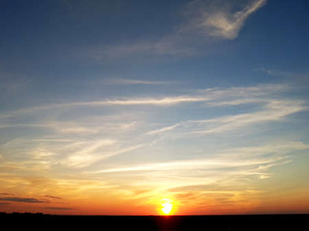 Blue orange sunset sky. Nature multicolored background.の写真素材