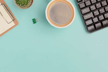 A workspace with stationery on a blue background. Concept: freelance, work at homeの写真素材