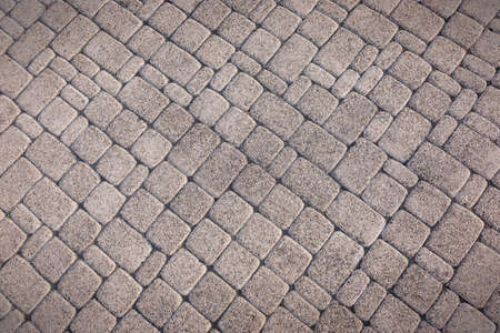 Gray stone tiles lying diagonally. Stone wall. A great background for your design.の写真素材