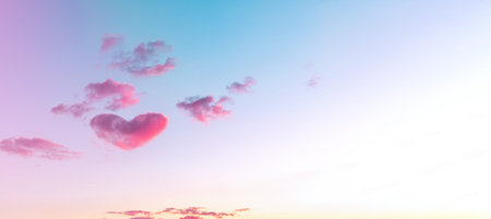 A large heart-shaped cloud in the sky after sunset. Banner.の写真素材