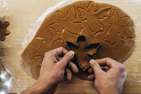 Set 17. Men's hands knead the dough. The chef prepares ginger. Christmas cookies on the table with cooking flour.の写真素材