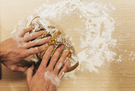 Set 6. Men's hands knead the dough. The chef prepares ginger. Christmas cookies on the table with cooking flour. Point of view.の写真素材