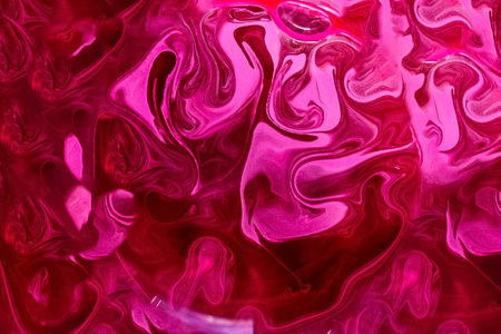 Abstract multicolored, pink and yellow drawing with paints on the water. Abstract background. Ebru technique. Selective focus.の写真素材