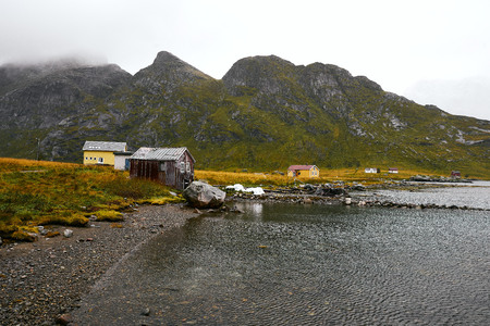 Remote boat house at the coast in Vinstad on Lofoten Islands in Norway.の写真素材