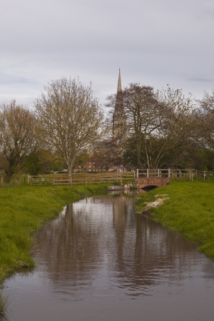 Salisbury cathedral and the west harnham water meadows in Wiltshire, England.の写真素材