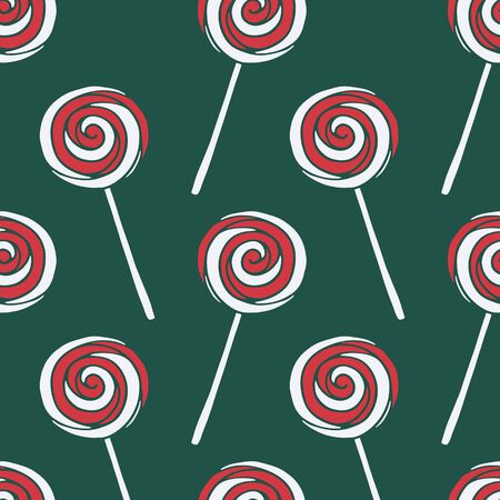 Vector seamless pattern with hand drawn christmas candies on dark green background. New Year and Christmas red and white sweet treats. Fabric, textile print, poster or greeting card templateの写真素材