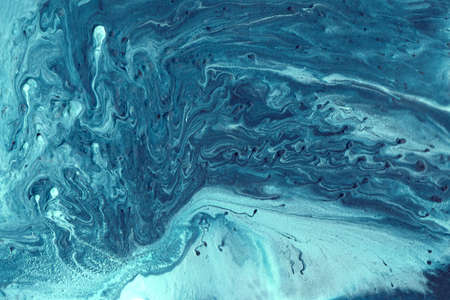 Abstract acrylic blue background. Fluid art illustration with swirl patterns. Liquid marble texture. Modern backdropの写真素材