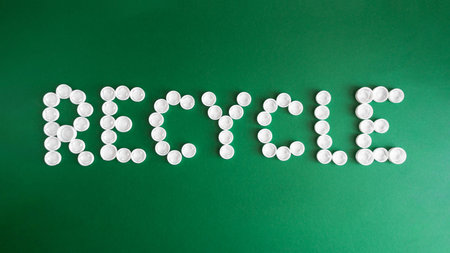 The word Recycle made of plastic bottle caps