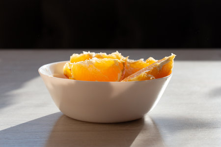 Picture of juicy fresh orange wedges in a bowlの写真素材