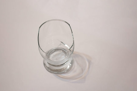 Broken transparent drinking glass in the kitchenの写真素材