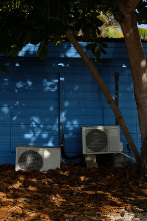 Old air conditioning units behind a house in Bonaire