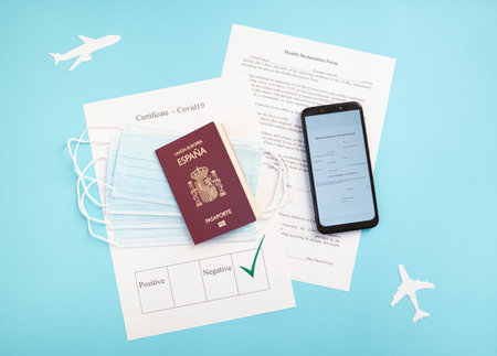 Passport with certificate of immunity, smartphone that shows health declaration, , ready to travel...