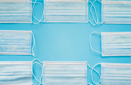 Surgical masks on a blue background.の写真素材