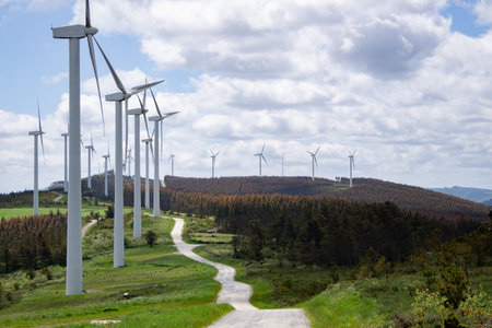 Windmills Producing Sustainable and Renewable energy Wind Power, mountain road.