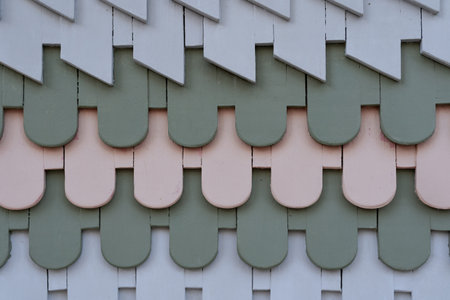 Colorful roof tiles on the facade of a modern house in Thailand.