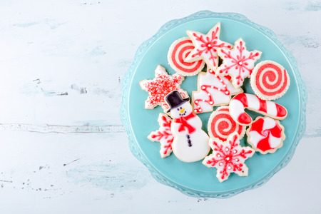 Red and White Christmas Sugar Cookies on a plateの写真素材