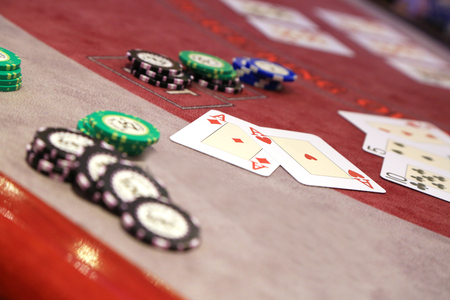 Playing cards and chips on casino tableの写真素材