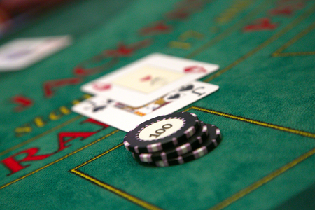 Casino chips and cards lying on tableの写真素材