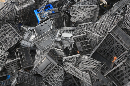 Piled black crates for scrapの写真素材