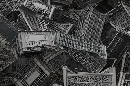 Piled black crates for scrapの写真素材