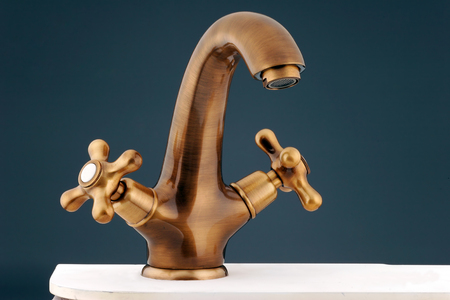 Bronzy metal tap of retro design. Faucetの写真素材