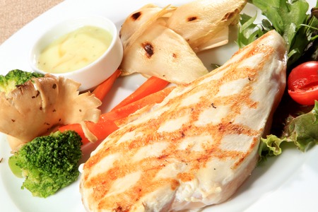 juicy grilled chicken fillet and vegetablesの写真素材