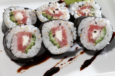 sushi with salmon and avocado in white plateの写真素材