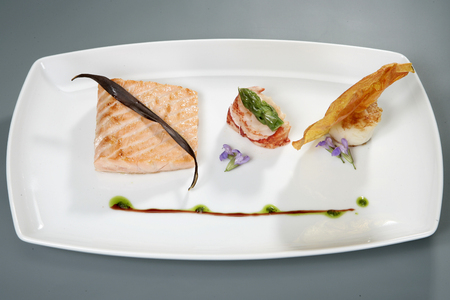 meat with decoration on white plate. gourmet foodの写真素材