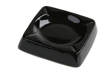 Empty black ceramic ashtray isolated on whiteの写真素材