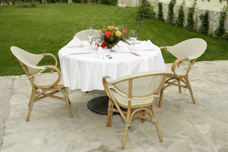 Table setting in gardenの写真素材