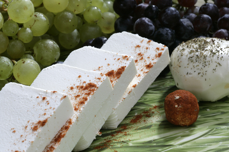cheese with spices and grapesの写真素材